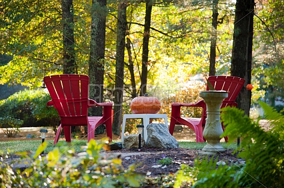 red adirondack chairs and pumpkin