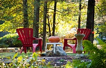 red adirondack chairs and pumpkin